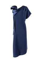 Navy blue dress with a shoulder  bow on a white background