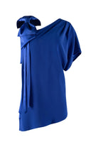 Royal blue one-shoulder top with a bow detail on a white background