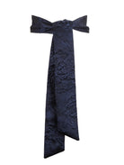 A dark navy blue belt with a textured, slightly metallic jacquard pattern, presented on a solid white background.