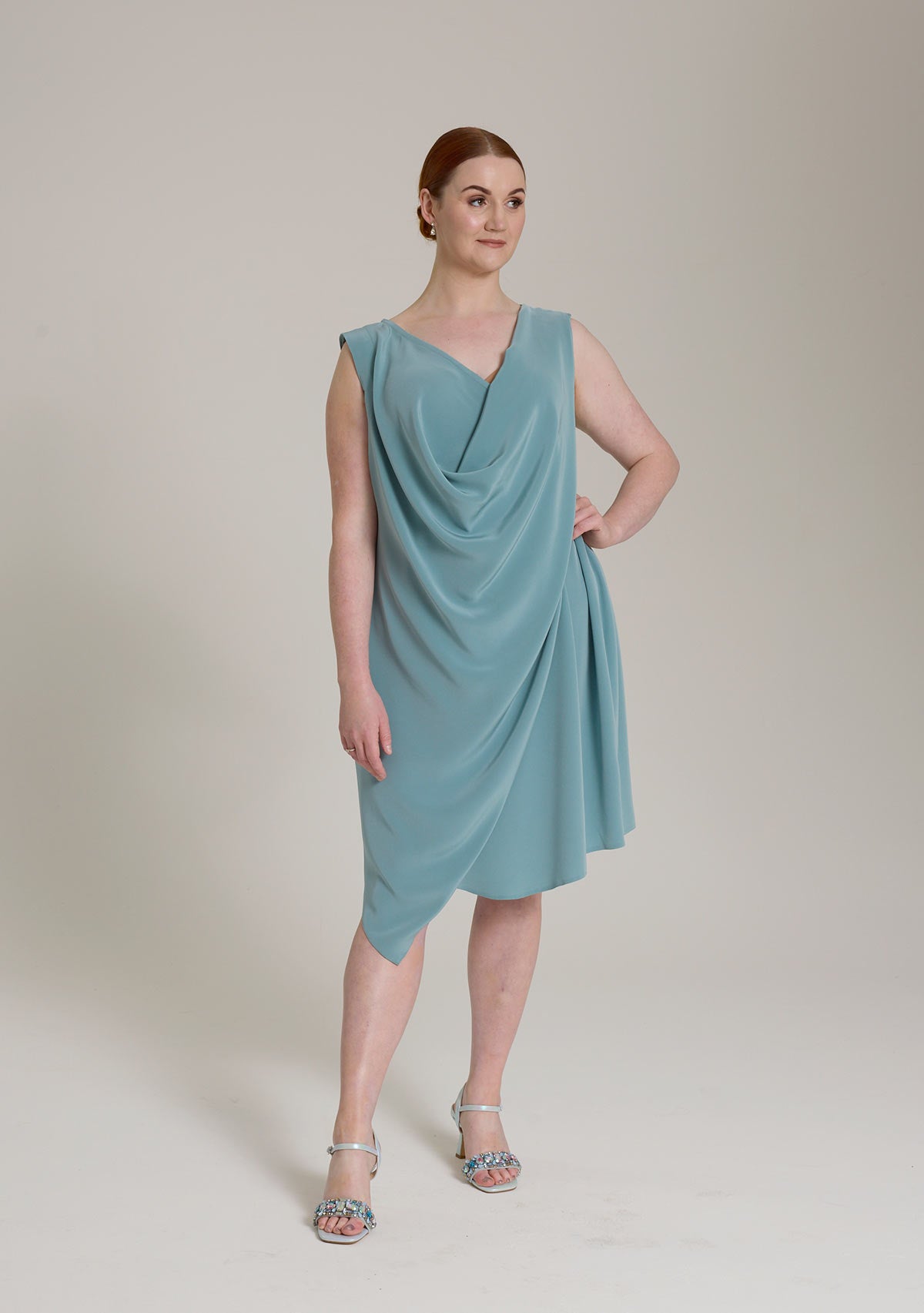 Monessa Joan sleeveless Ailbhe dress with draped neckline and asymmetrical hemline.