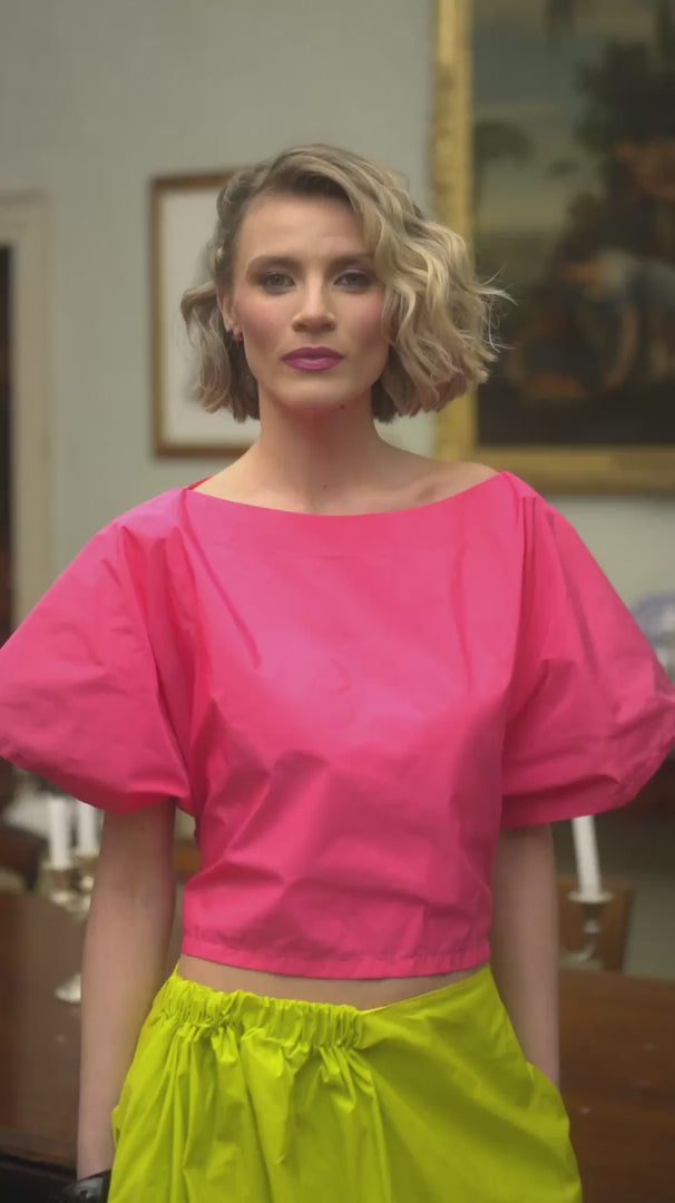 Woman wearing  lime yellow skirt with cerise top