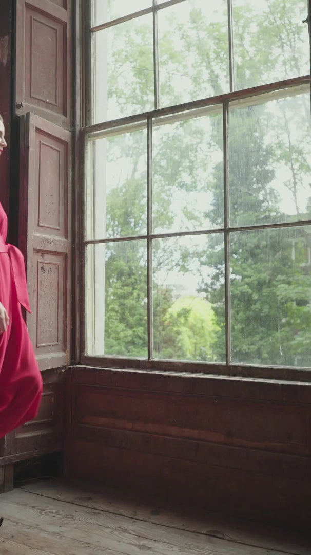 video of a blond hair woman in a red dress