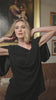 video of a woman wearing a black  outfit
