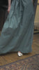 Woman wearing duck egg skirt with flower top