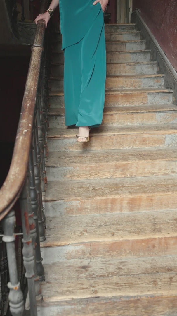 video of a woman wearing Saibh trousers in an ornate classical room