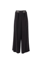Black wide trousers on a white background