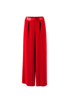 Red wide trousres on a white background